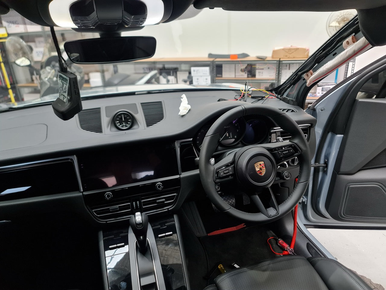 2024 Porsche Macan GTS parked at MC Audio workshop before dashcam install