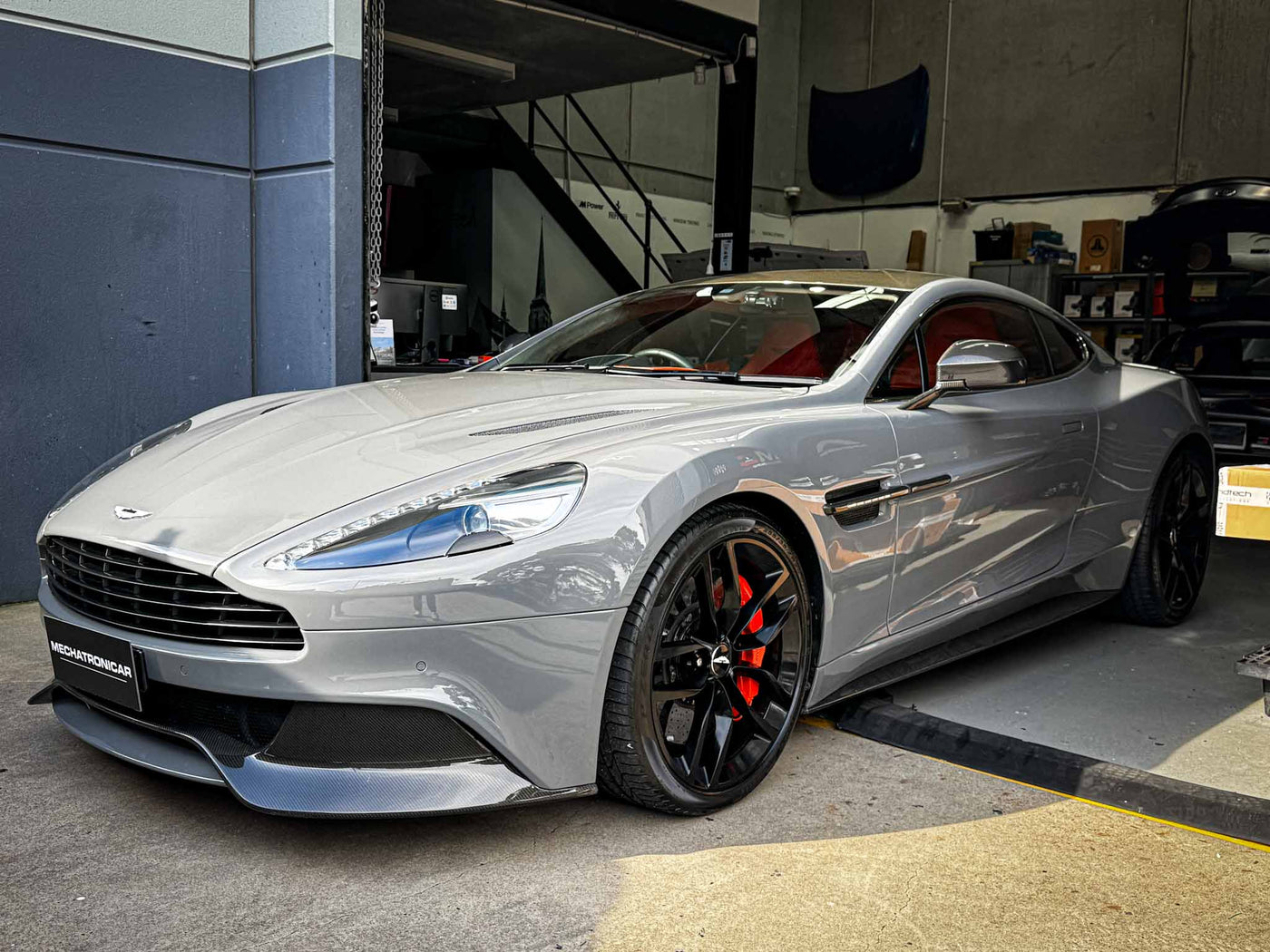 Aston Martin Vanquish front with BlackVue 4K dashcam installed.