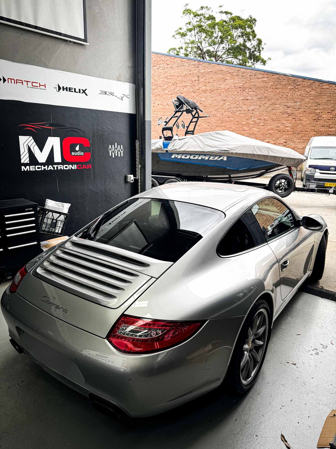 Porsche Carrera parked outside MC Audio workshop in Sydney