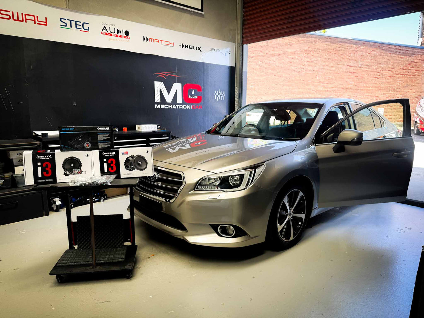 Subaru Liberty parked outside MC Audio workshop in Rockdale sydney
