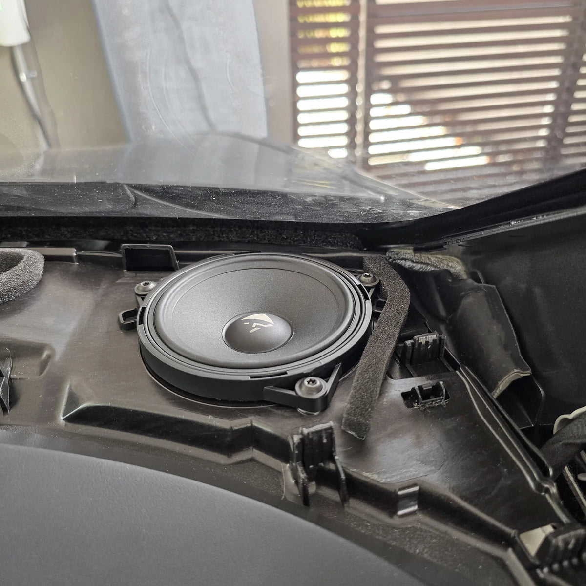 HELIX Ci3 midrange installed in the Tesla Model Y dashboard as part of the front speaker upgrade