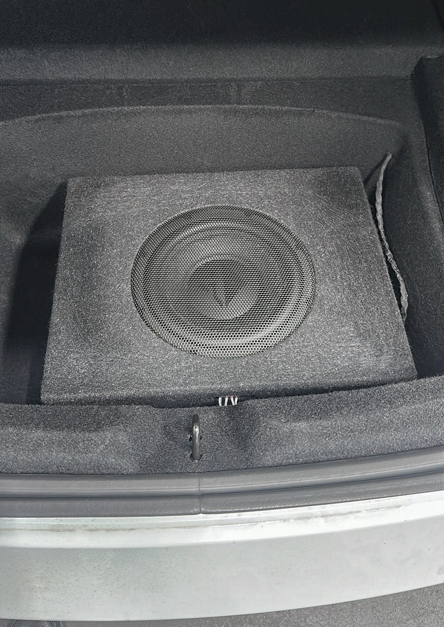 HELIX loaded subwoofer enclosure installed in the Tesla Model 3 boot as part of the DSP audio upgrade