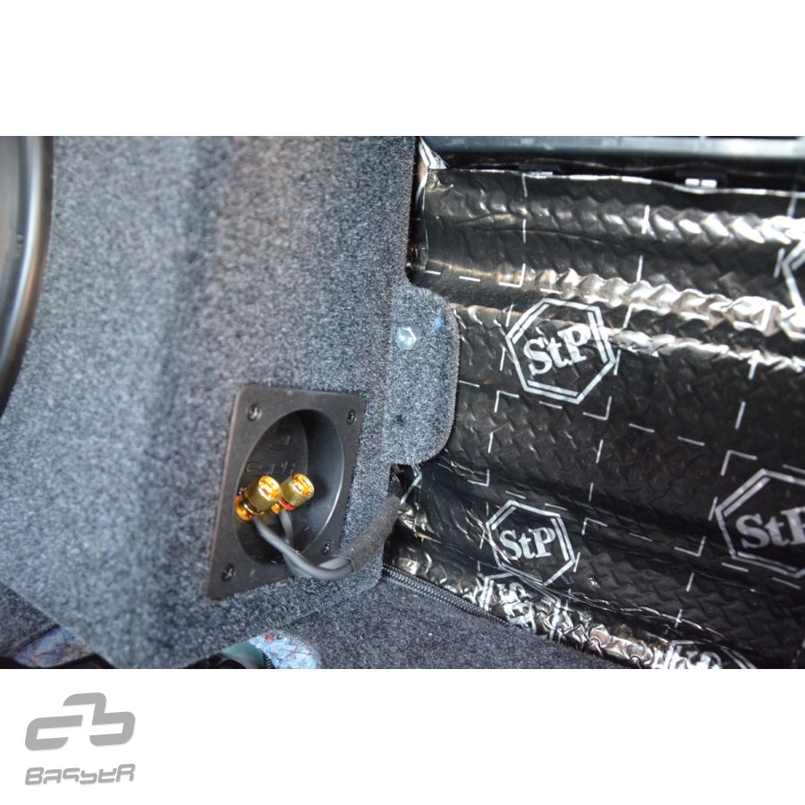 Installed BASSER 10” Fit-Box subwoofer enclosure behind seat – Toyota Hilux 2015–2023 by MC Audio Sydney