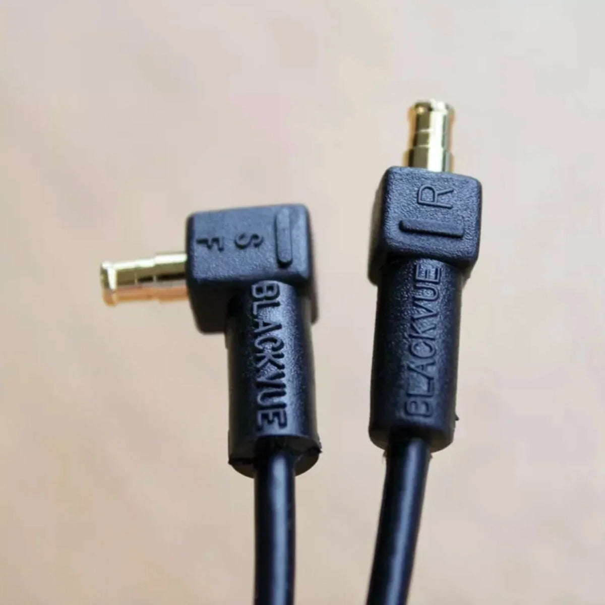 BlackVue rear camera cable connector close-up showing the angled and straight coaxial ends for dash cam installation