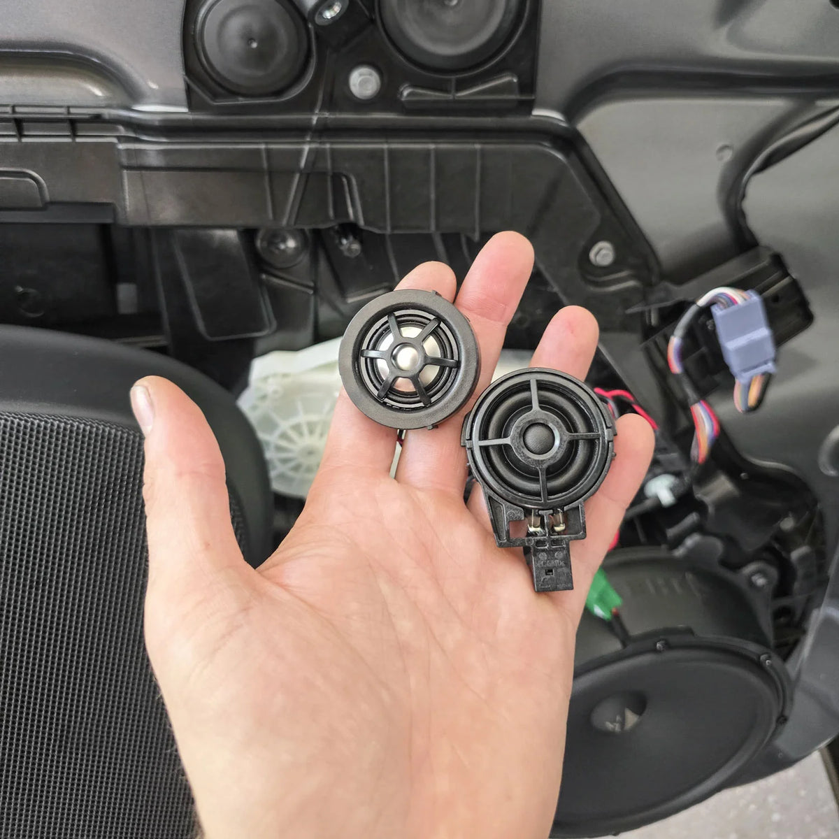 HELIX Ci3 tweeter beside the factory Tesla Model Y tweeter during the front speaker upgrade