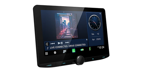 Kenwood DMX9724XDS angled view showing music playback and clock widgets on the 10.1-inch floating touchscreen